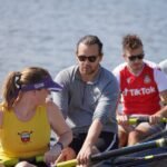A rowing team competing on a river
