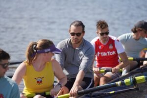 A rowing team competing on a river