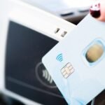 Person making a contactless card payment at a payment terminal