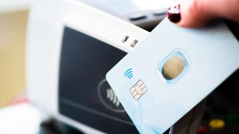 Person making a contactless card payment at a payment terminal
