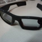 A pair of smart glasses with a built-in display and camera
