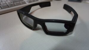 A pair of smart glasses with a built-in display and camera