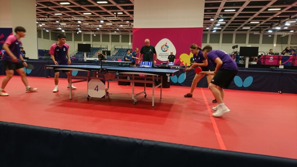 Special Olympics athletes competing in a table tennis match