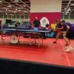 Special Olympics athletes competing in a table tennis match